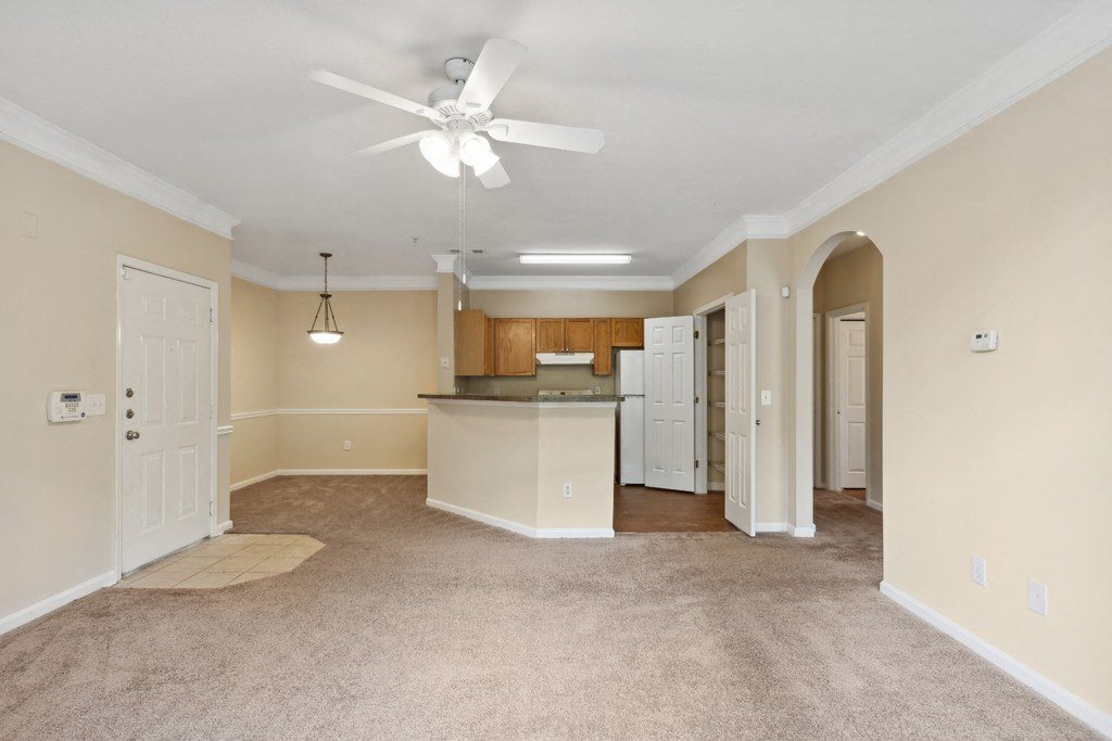 Carpeted living room at Longwood Vista Apartment Homes in Atlanta GA
